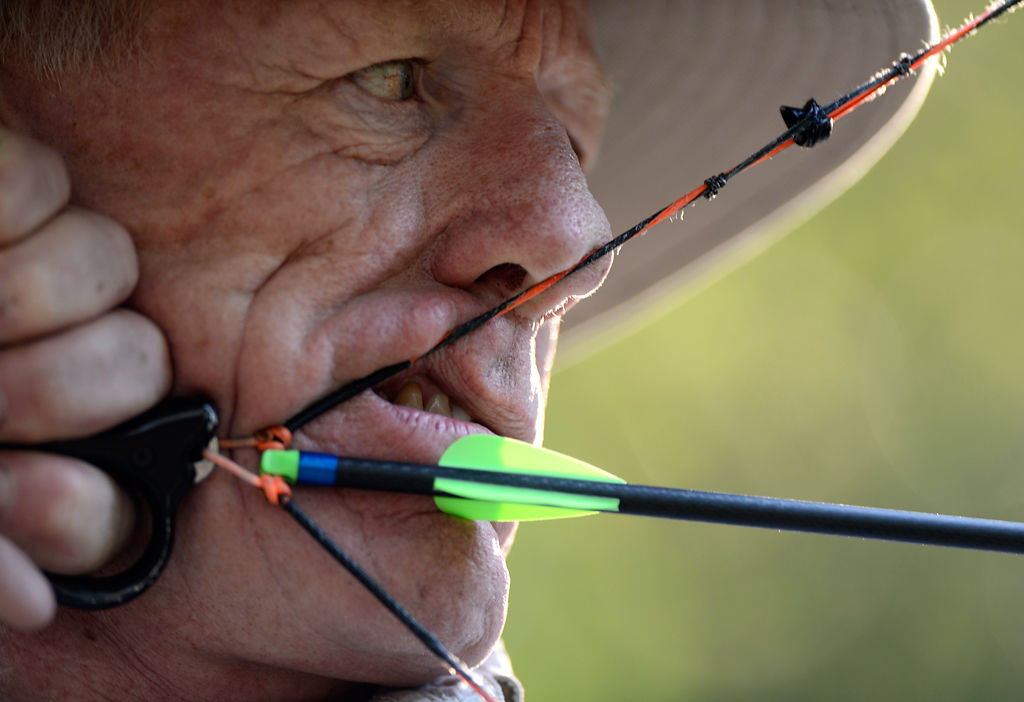 Dennis Dudley of Columbia draws his bow back